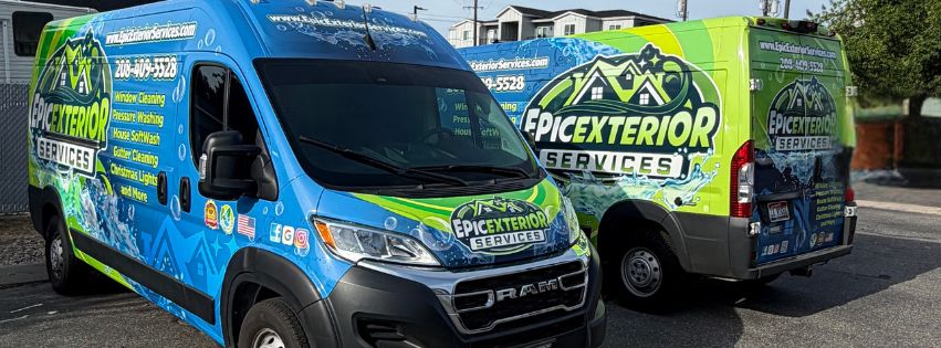 Two Epic Exterior Services wrapped vans parked side by side in the Treasure Valley